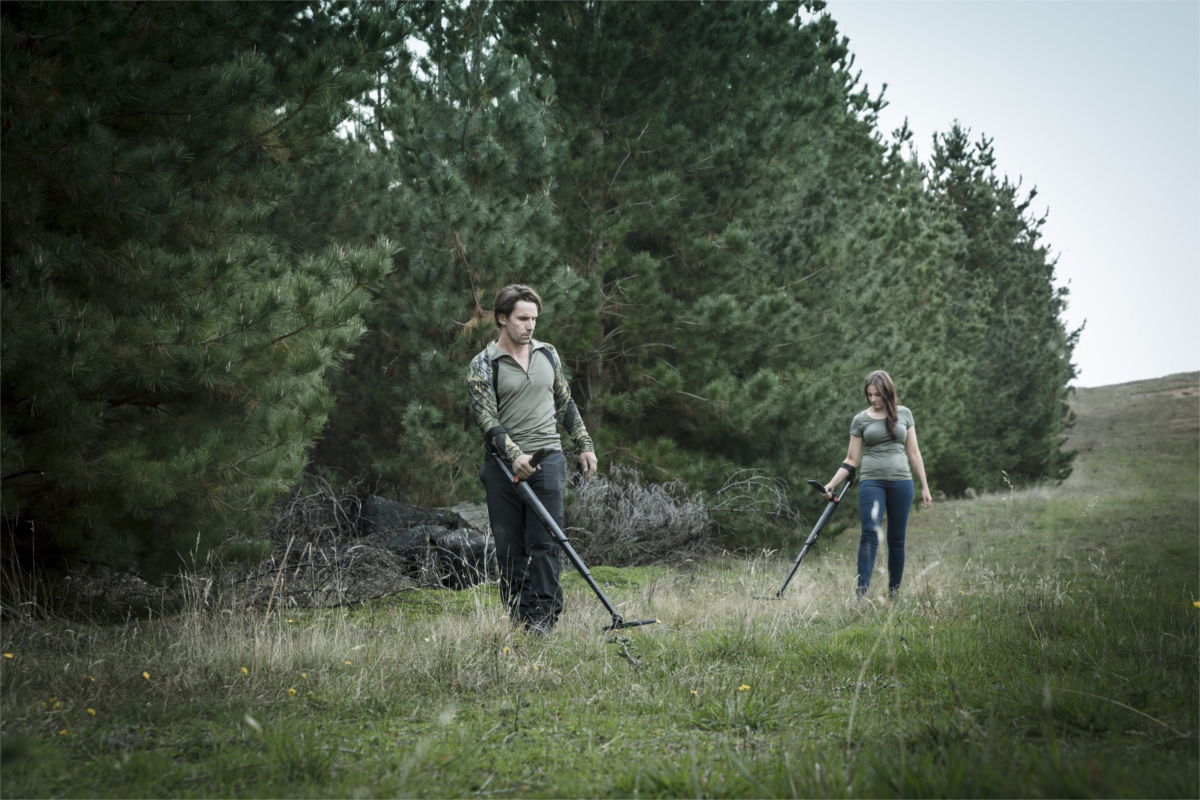 Couple detecting in forest